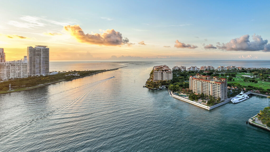 Waterfront view of Fisher Island, highlighting luxury living and exclusive boating amenities.